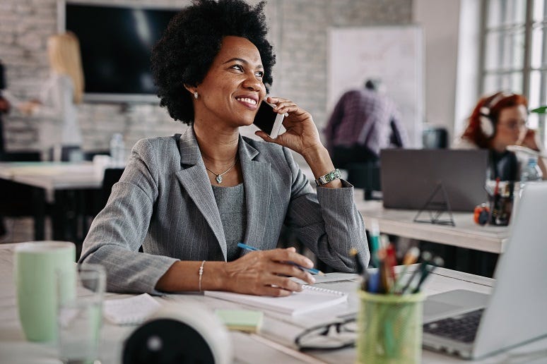 Smiling businesswoman on the phone Smiling businesswoman on the phone