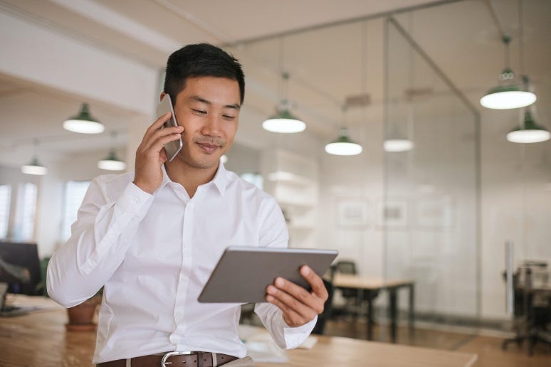 A person on their phone working A person on their phone working
