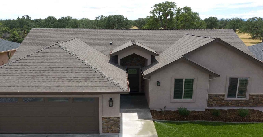 PABCO Premier Radiance Cool Weathered Wood shingles make up the roof of a residential home