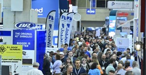 Attendees on the show floor at a construction industry event