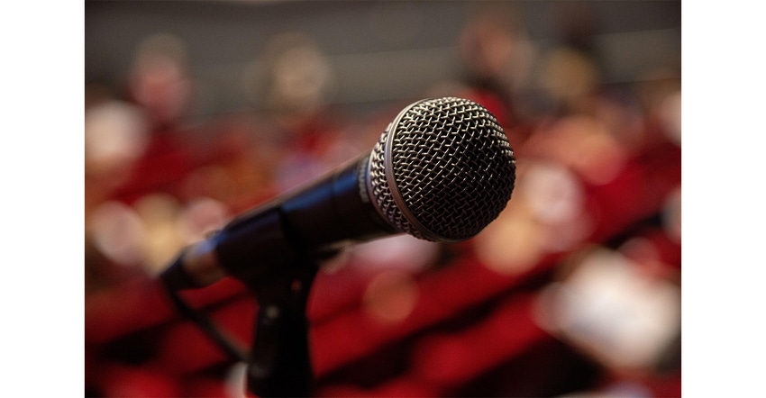 Microphone close-up in a conference auditorium, positioned for delegated to speak in a large auditorium