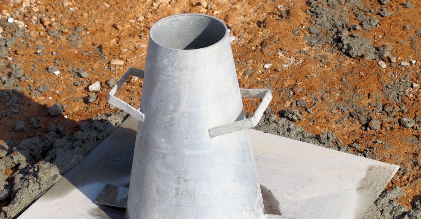 Slump test cone apparatus used to check that fresh concrete complies with workability specifications.