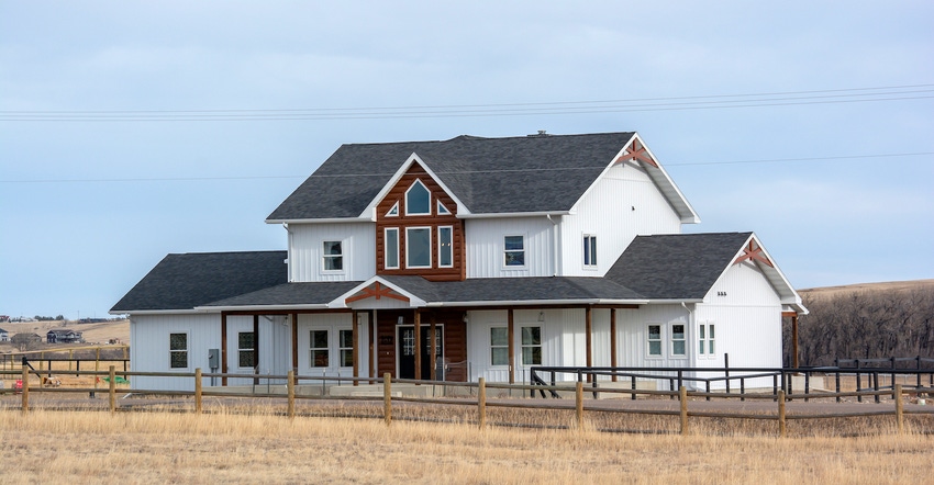 Front elevation of farmhouse-log cabin home