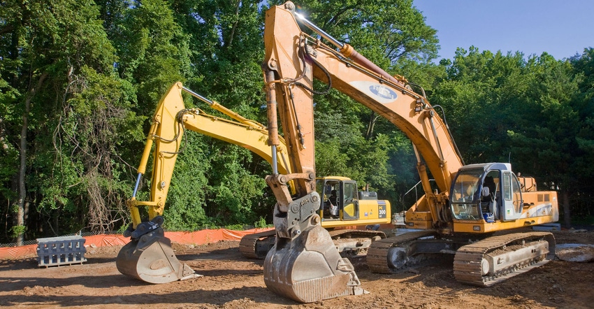 Two Front End Loaders Excavators At Construction Site, USA