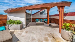 CarbonShack Design undulating reclaimed wood rooftop deck in California