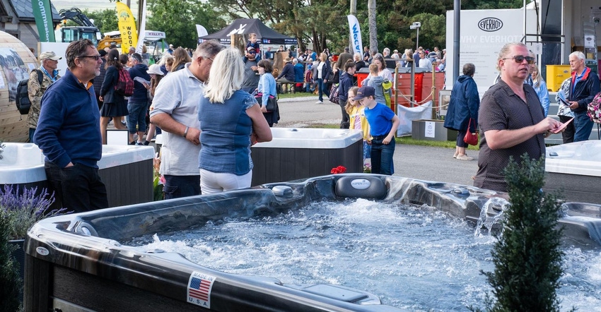 The latest in large luxury, garden based hot tubs being checked out by families, children and adults at the Royal Cornwall