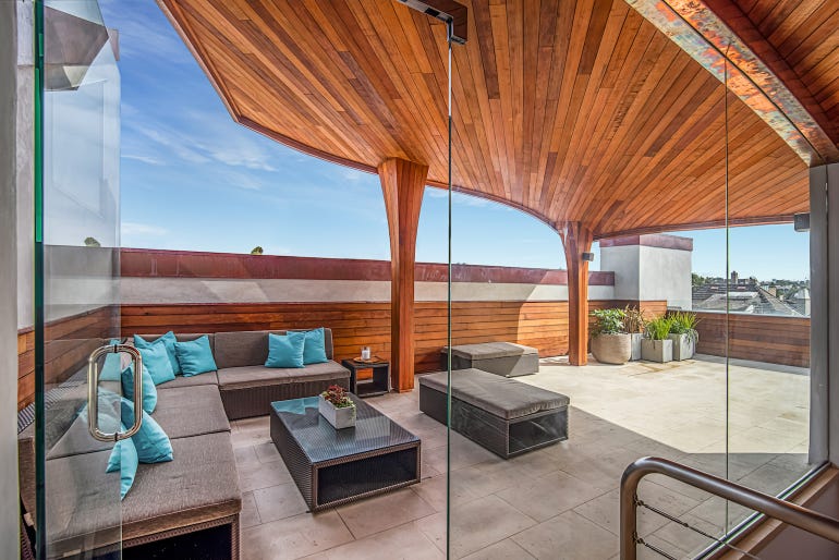 CarbonShack Design undulating reclaimed wood rooftop deck in California