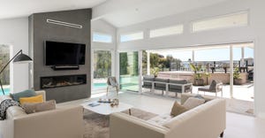 Modern living room with view to outdoor living area.