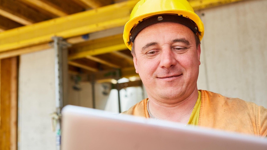 Construction leader with tablet during planning on construction site