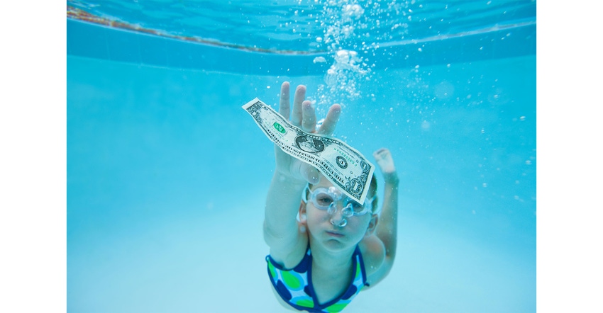 Girl swimming in pool and reaching for one dollar banknote