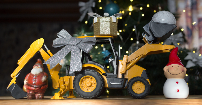 A bulldozer and a holiday themed display. 