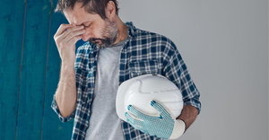 Tired and worried construction industry worker feeling exhausted and disappointed
