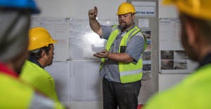 Contractor leading team meeting_Alamy_RE_072522.jpeg