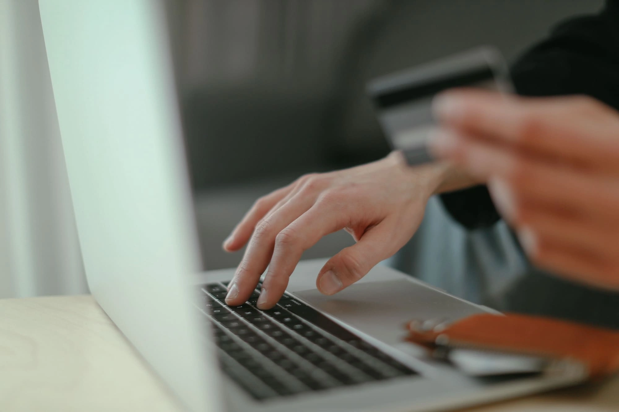 Business owner making card payment on laptop