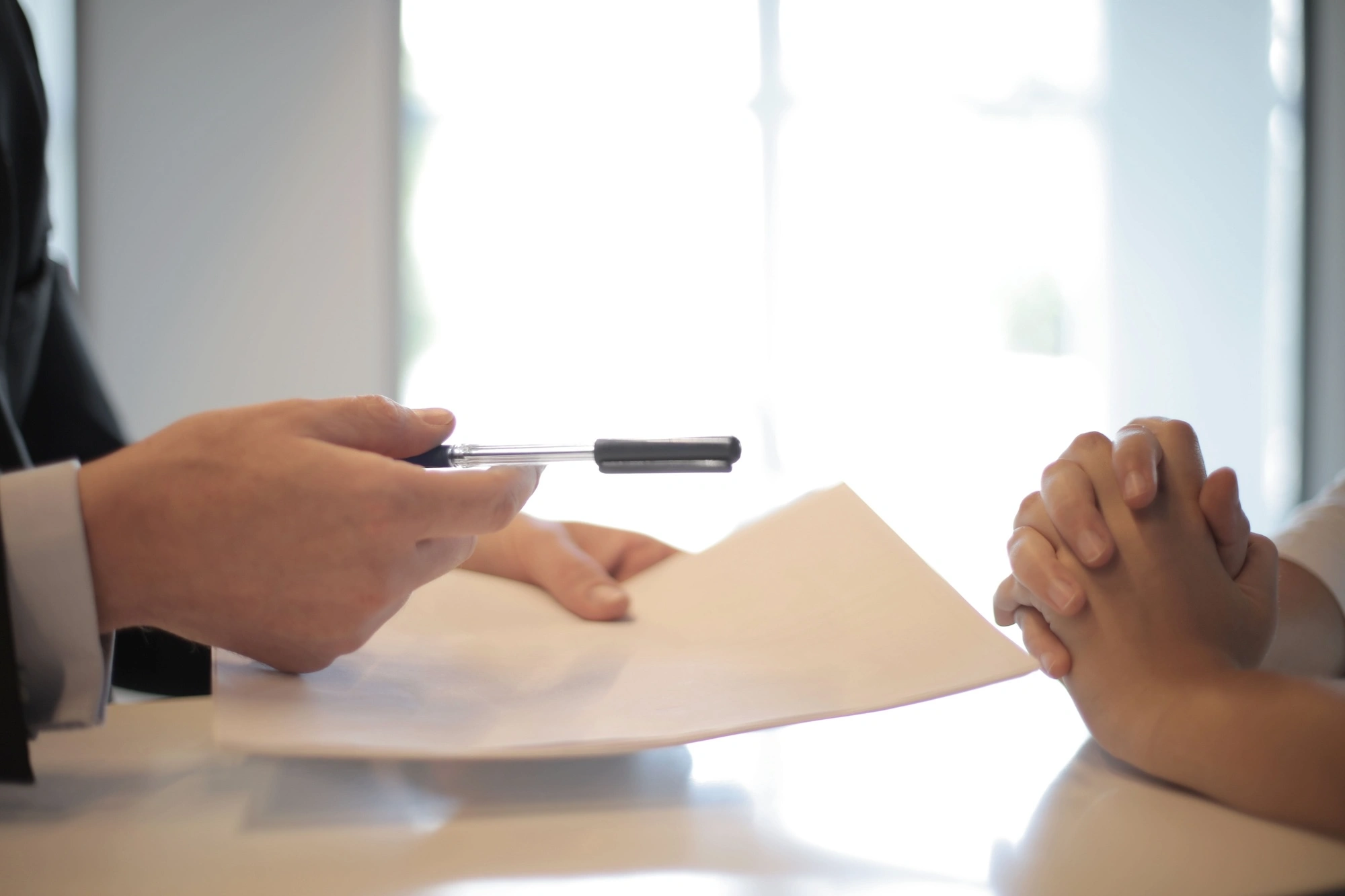 Business owner signing document.