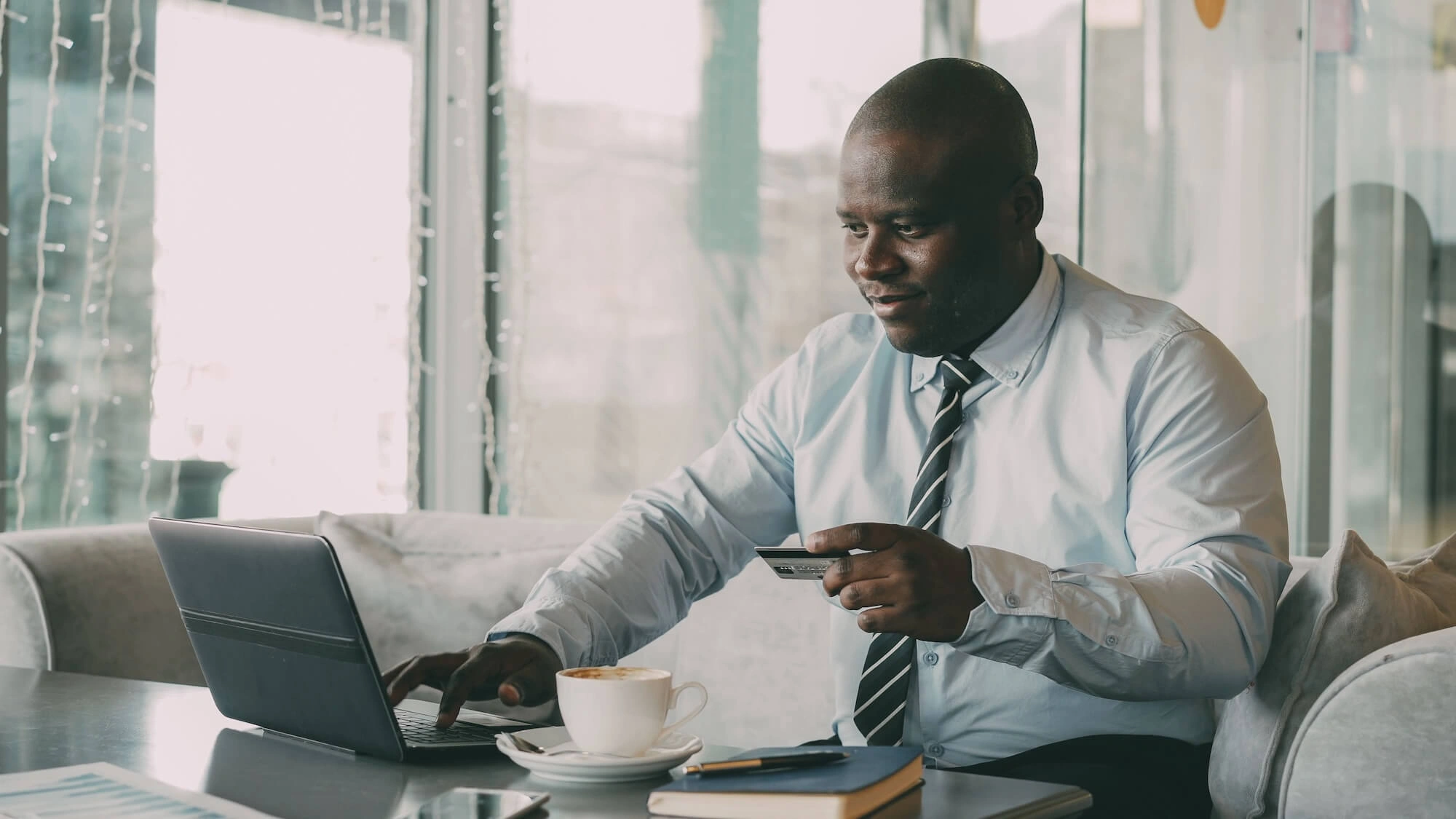 Business owner making online payment with credit card
