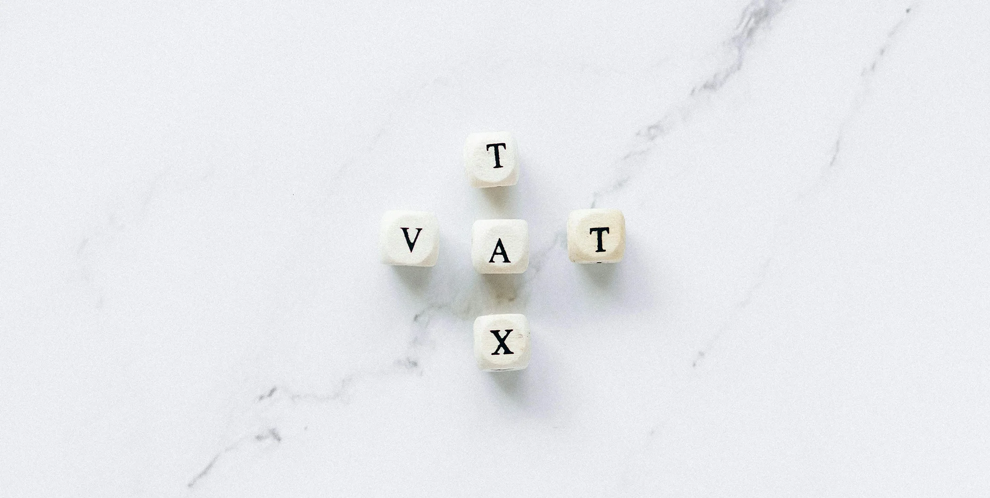 blocks spelling out VAT tax on a marble surface