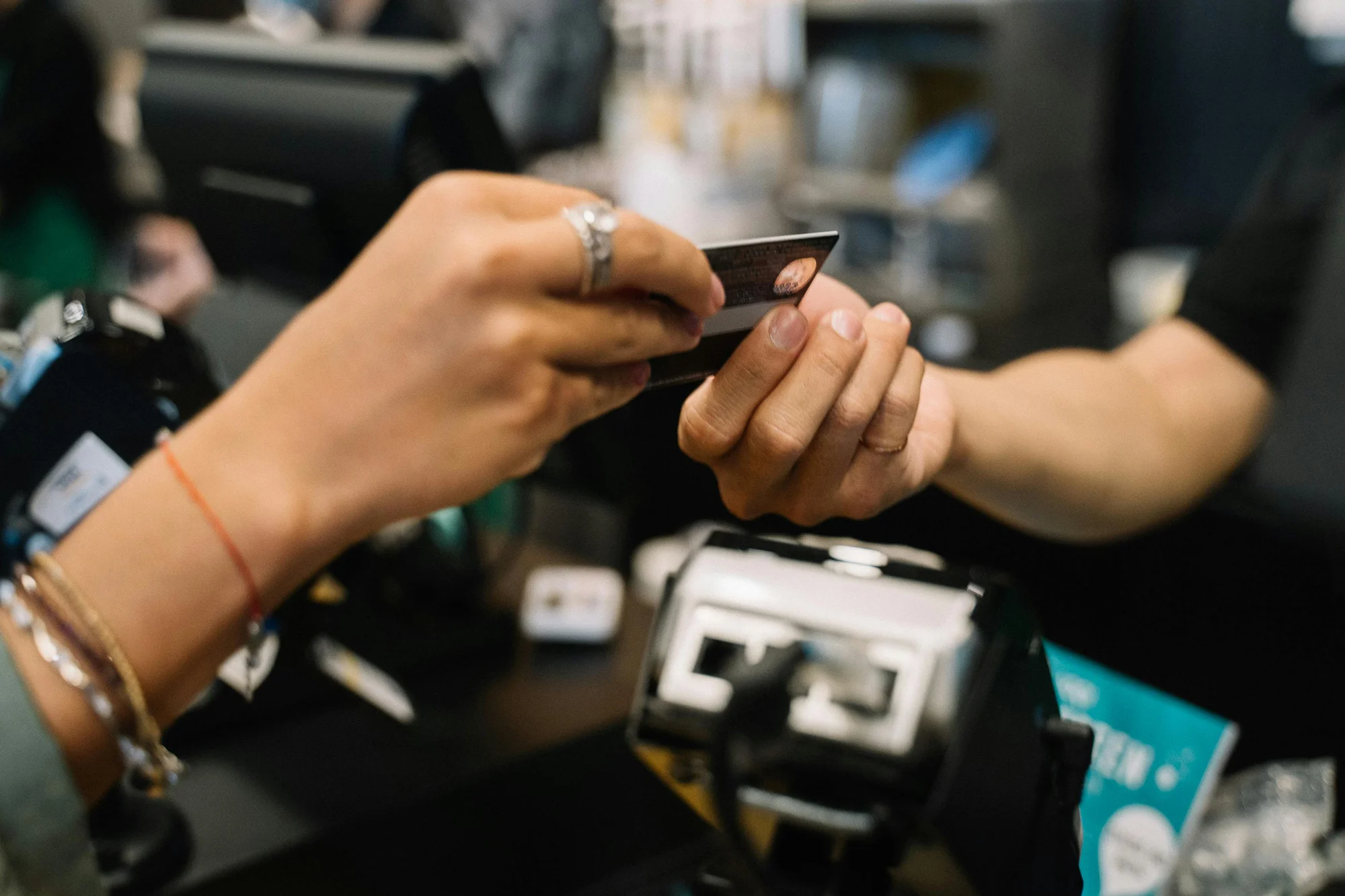 A credit card being used in a shop