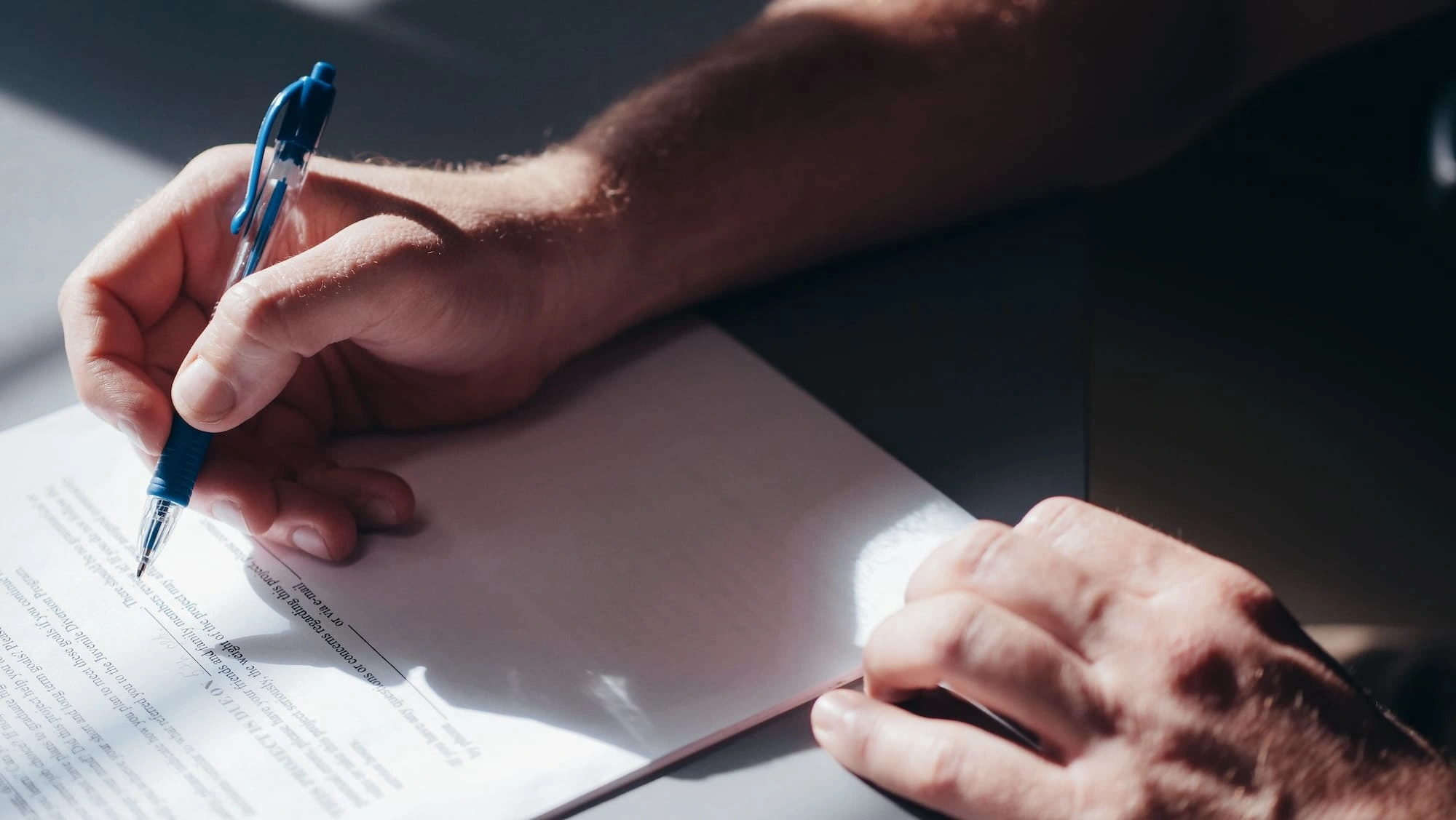 Business owner signing loan document
