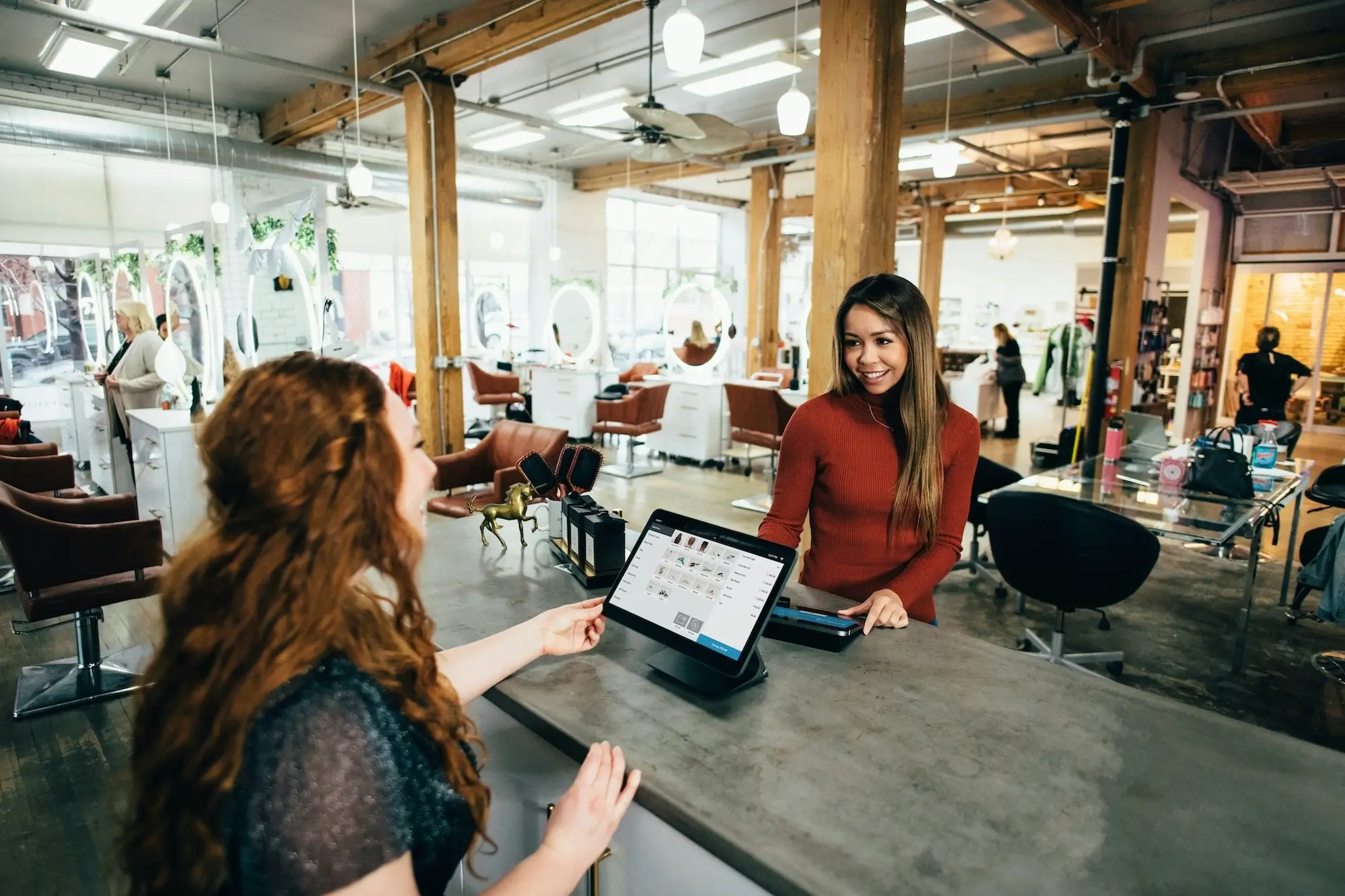 Business making sale at till.