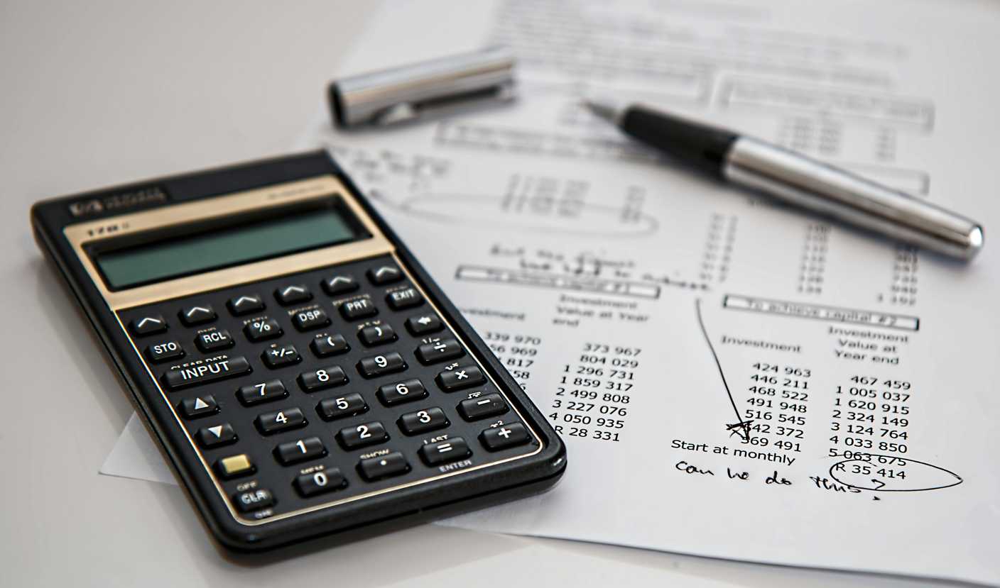 Calculator and paper on a desk