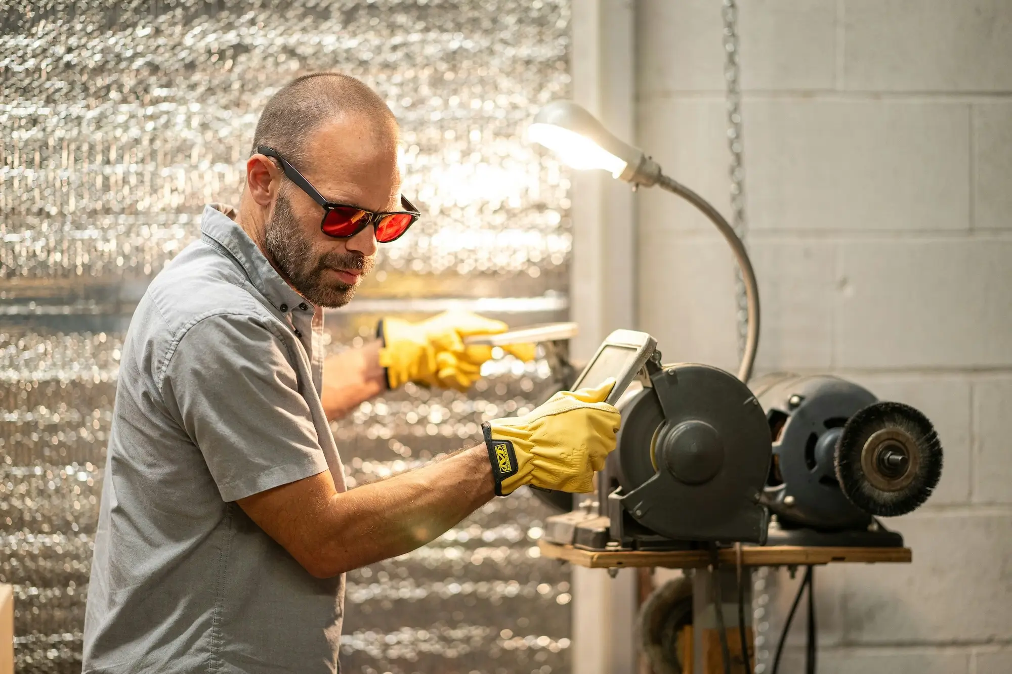 Man working with power tool.