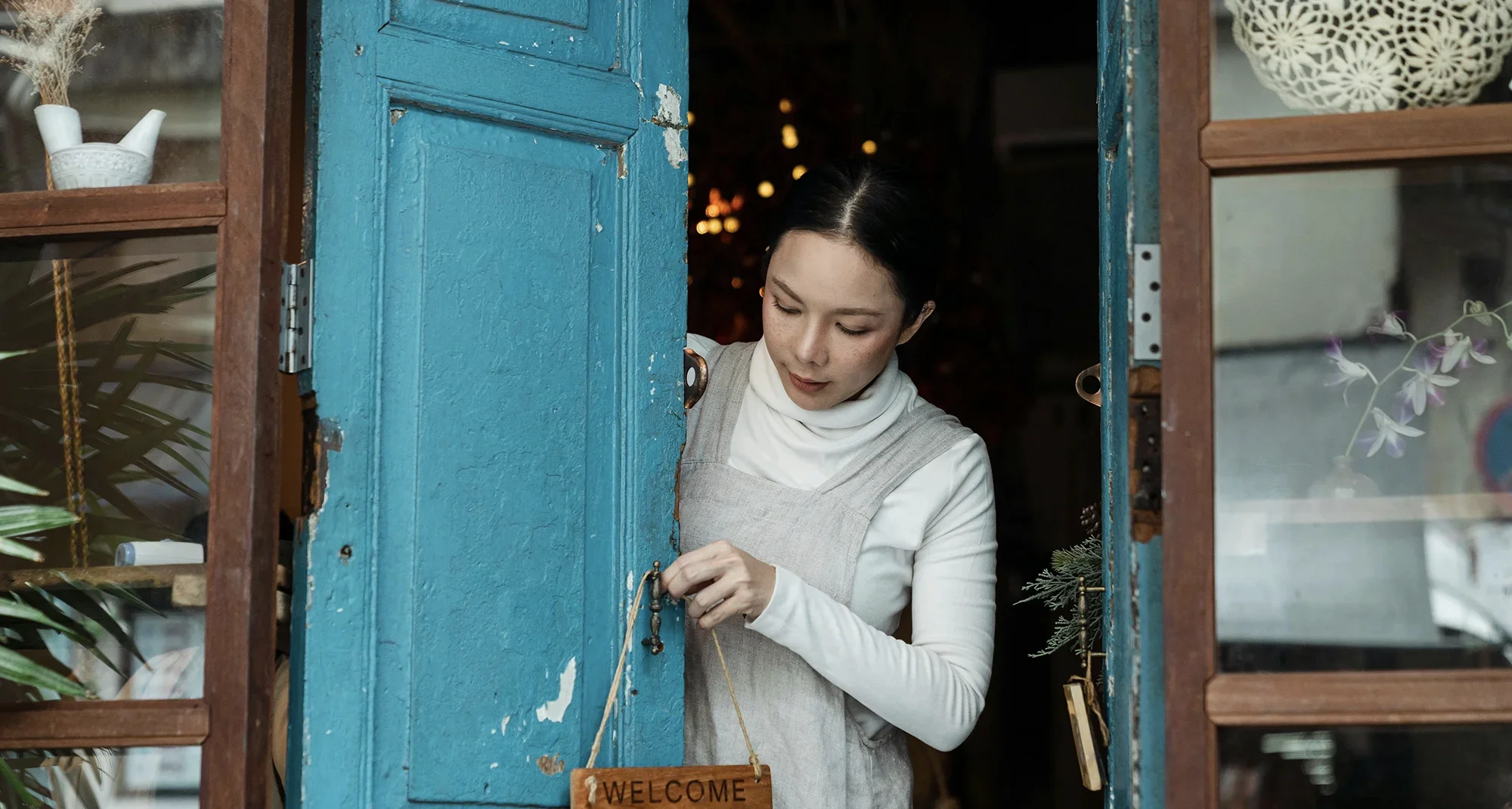 A business owner opening her shop