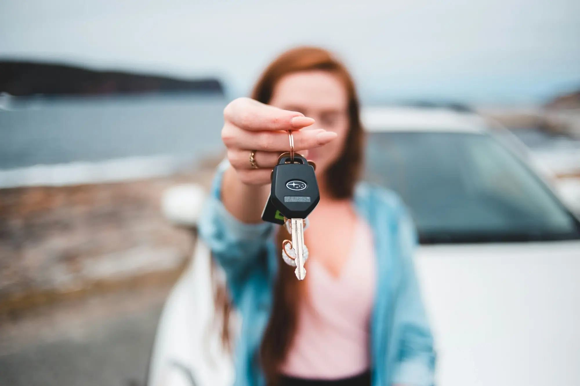 Business owner presenting car keys