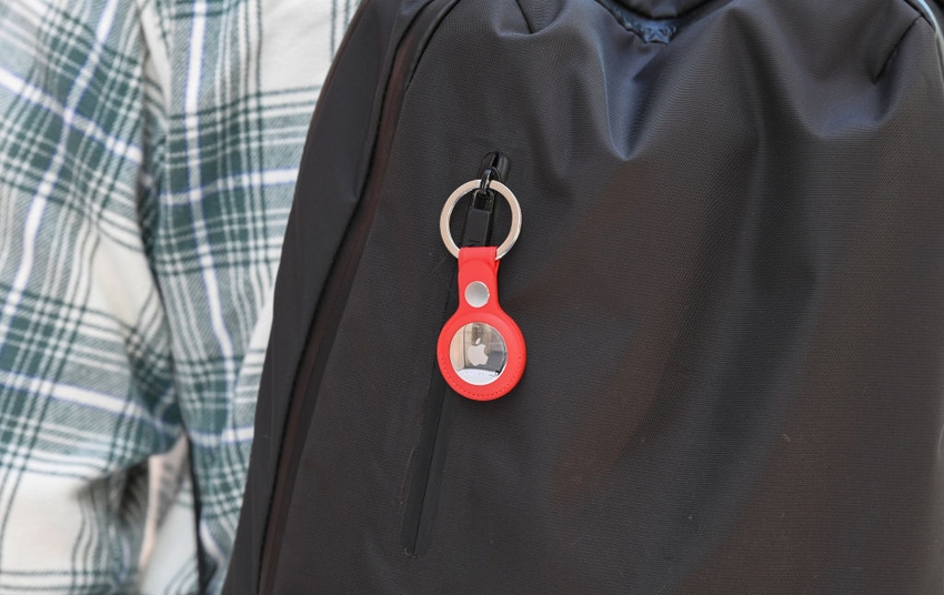 Image shows an Apple AirTag on a backpack