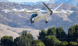 Archer Aviation's Midnight air taxi flies above trees.