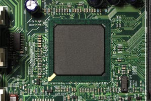 Close-up of microprocessor chip on motherboard in computer.