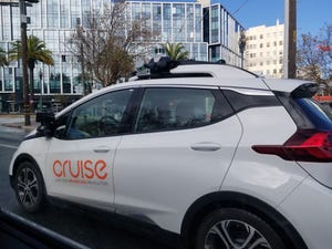 Side view of a driverless car from technology company Cruise Automation navigating the streets of San Francisco, California.
