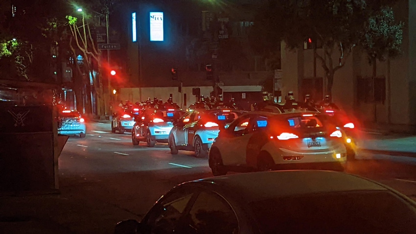 Image shows a fleet of Cruise robotaxis blocking a San Francisco intersection