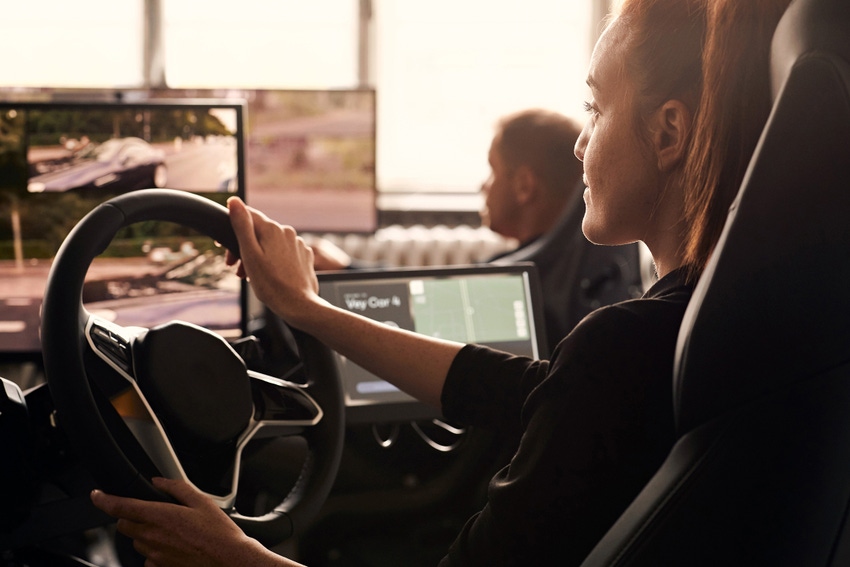 Image shows a remote operator operating a vehicle remotely from a station miles away from where the actual vehicle is.