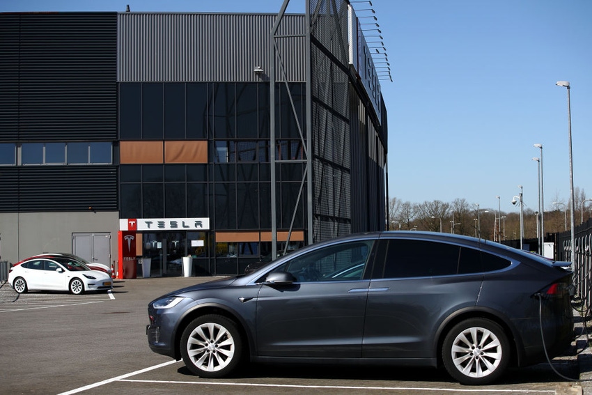Image shows the outside of a Tesla assembly plant in the Netherlands.