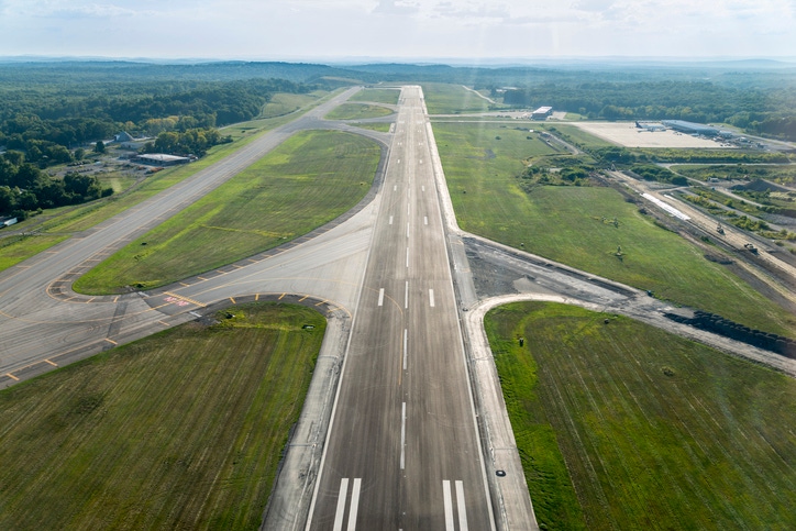 Image shows an aerial view of airplane landing strip
