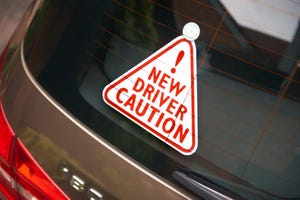 Image shows a new driver sign in cars rear window