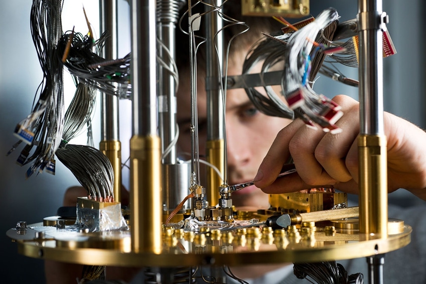 A researcher working on quantum computer components