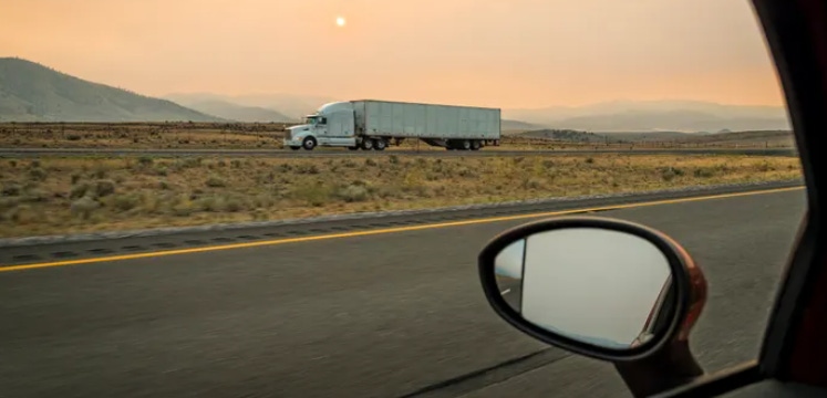 A truck alone on a highway A truck alone on a highway