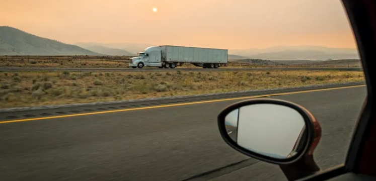 A truck alone on a highway