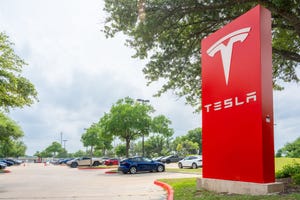 The Tesla logo is displayed at a Tesla dealership on April 15, 2024 in Austin, Texas