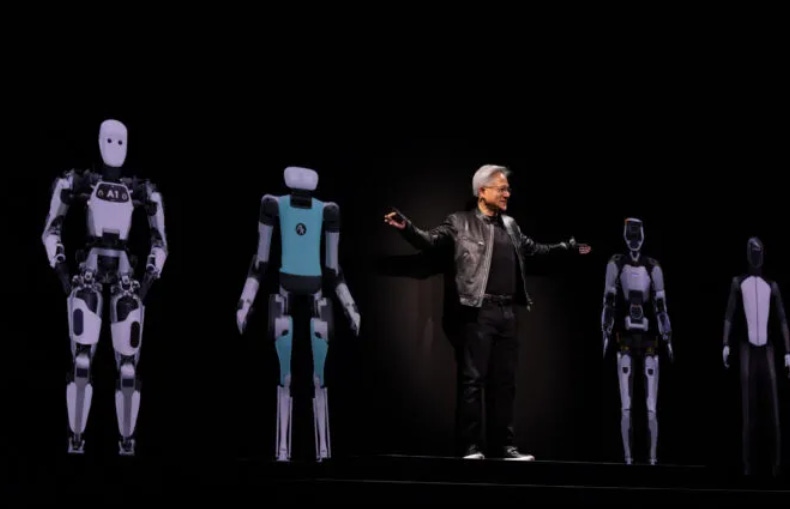 Nvidia CEO Jensen Huang stands on a stage in front of robots during a keynote at the annual Computex event in Taiwan. 