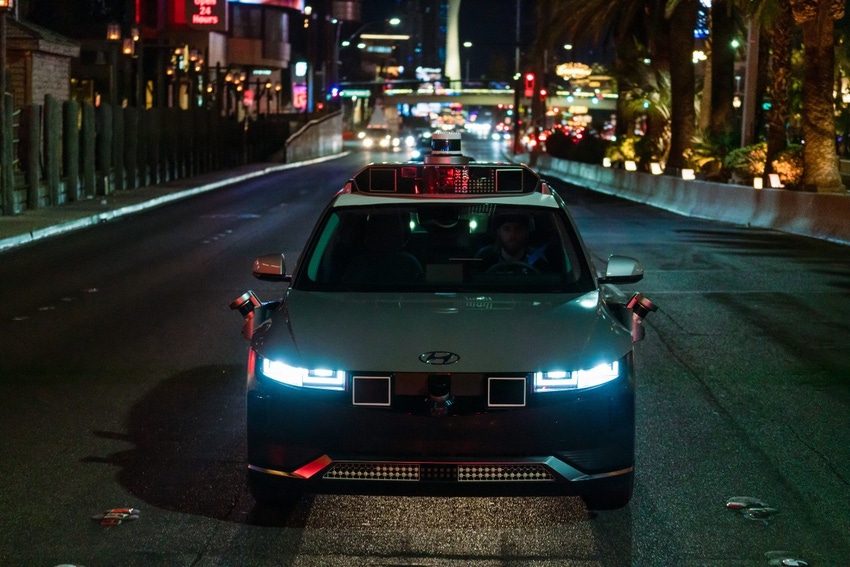 A Motional self-driving taxi at night. 