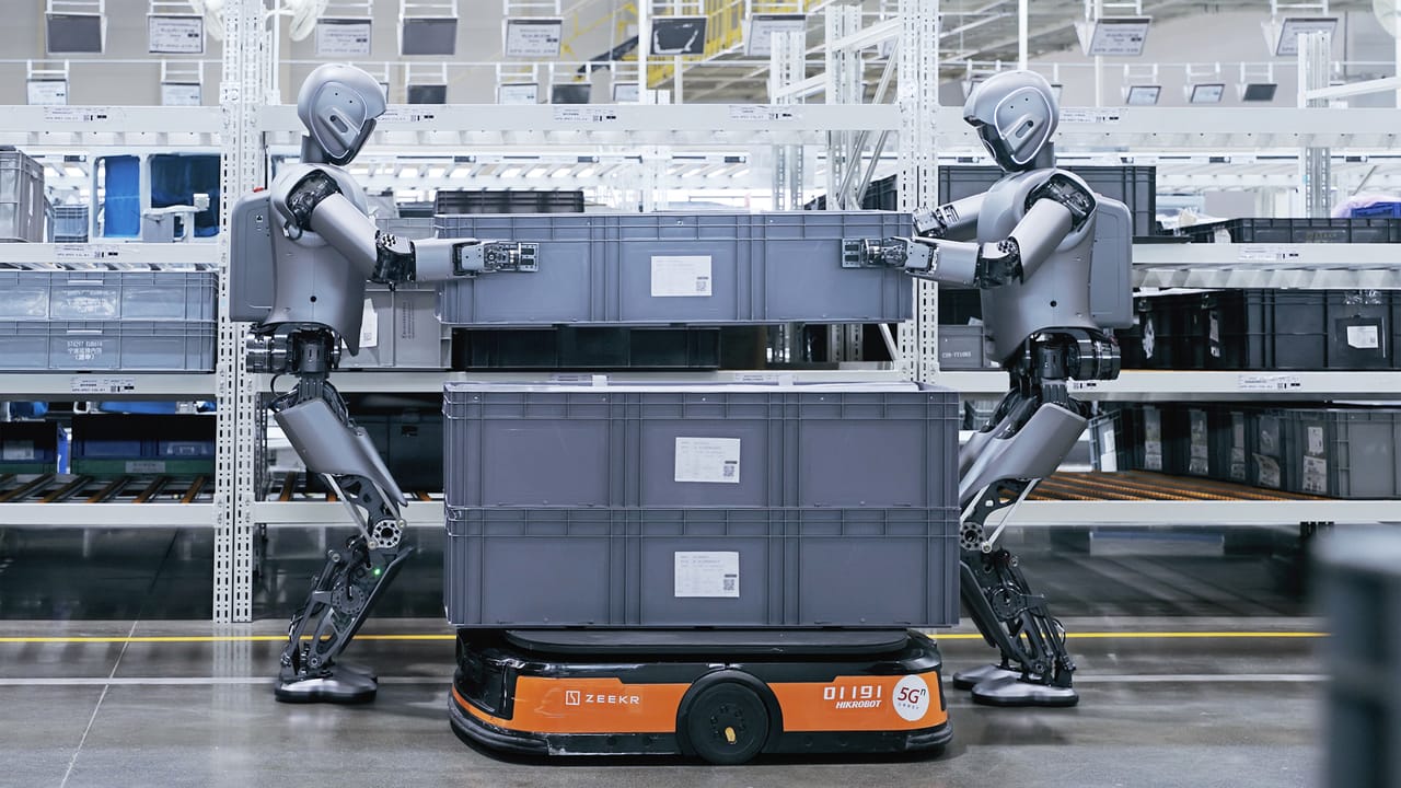 Humanoid Robots Work Collaboratively at Auto Factory