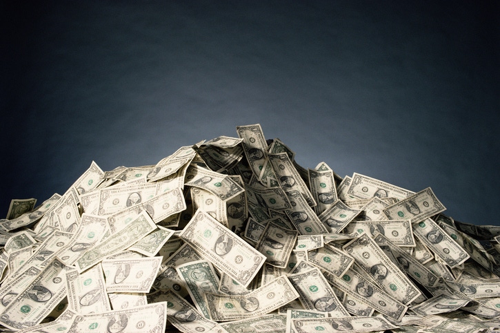 Big pile of dollar bills Big pile of dollar bills