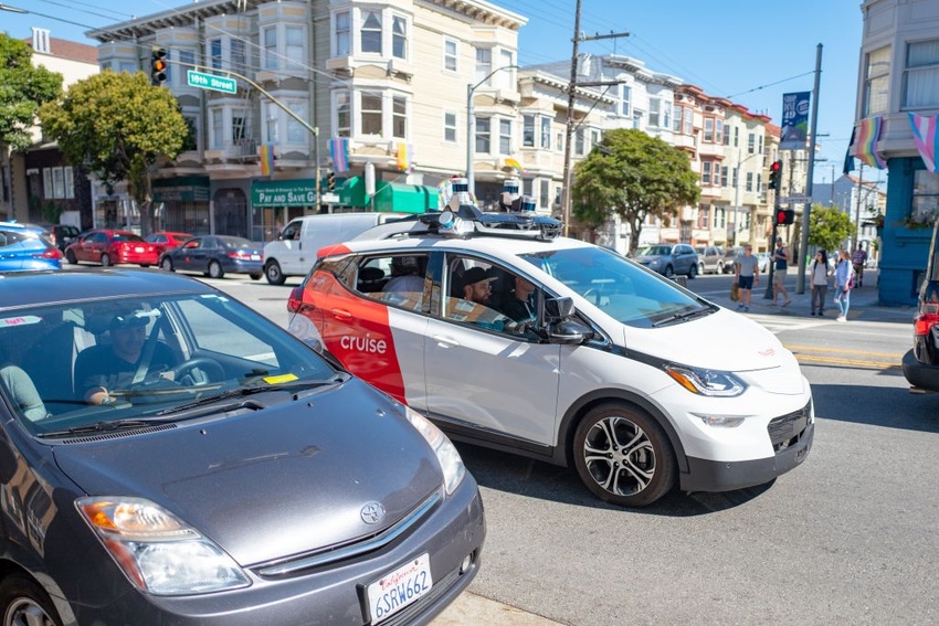 Image shows General Motors Cruise self-driving car undergoing testing on the streets of the Mission District neighborhood of 