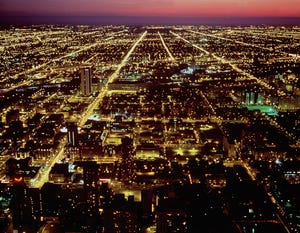 Image shows Chicago illuminated at night.