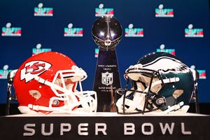 Image shows football helmets of the Philadelphia Eagles and the Kansas City Chiefs ahead of Super Bowl LVII