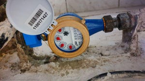 Image shows a newly installed water meter with seal.
