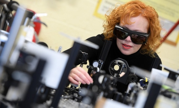 Kimberley Hall uses an ultrafast laser in her lab. 
